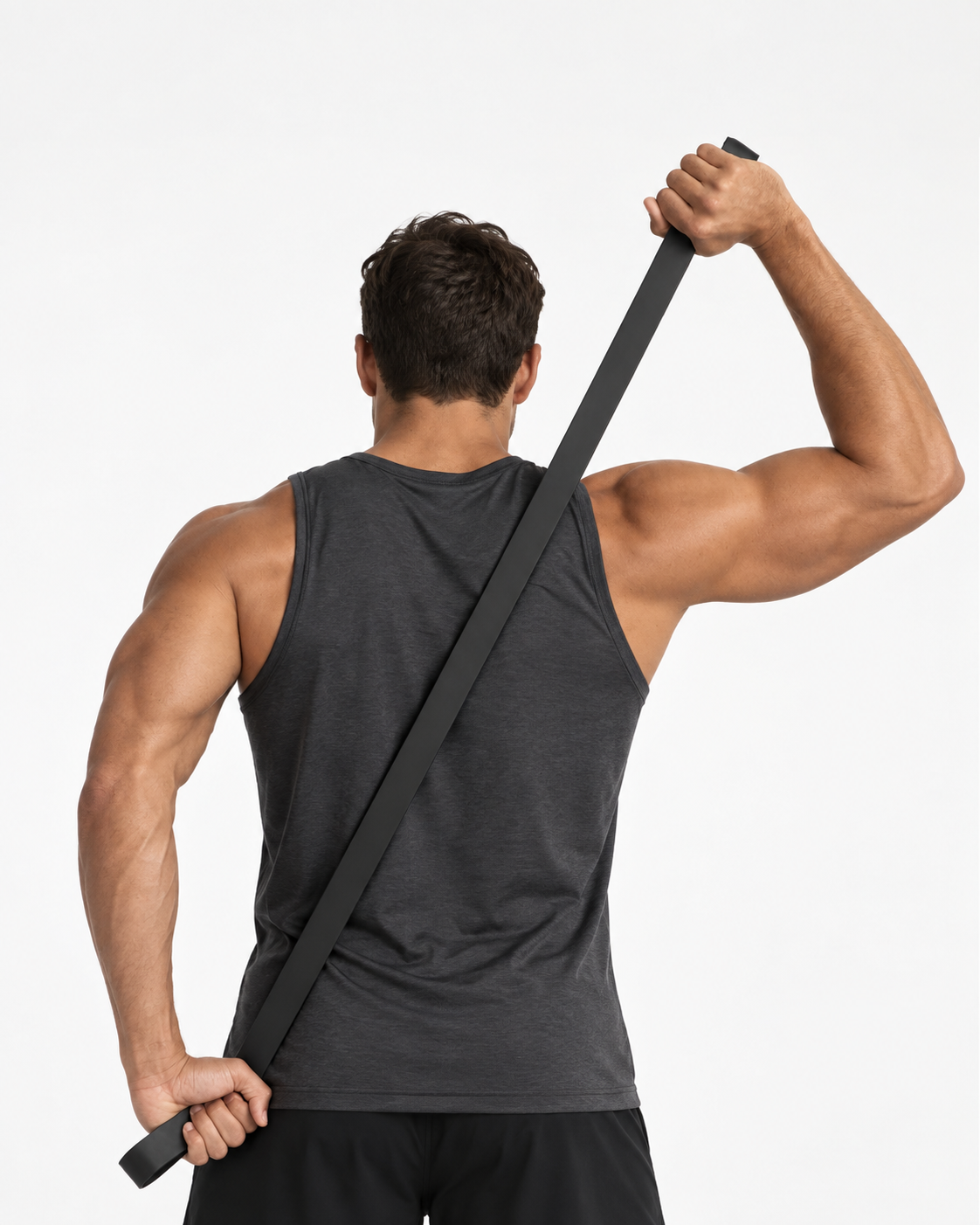 Athlete stretching a plain black resistance band diagonally across his back.